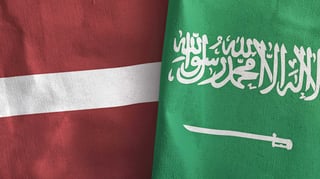 Latvia and Saudi Arabia flags close-up
