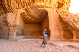 Woman Admiring Jabal Ithlib Rock Cut Tombs In Archaeological Site Of Hegra The Diwan And Siq