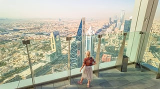 Tourist viewing modern Riyadh from above