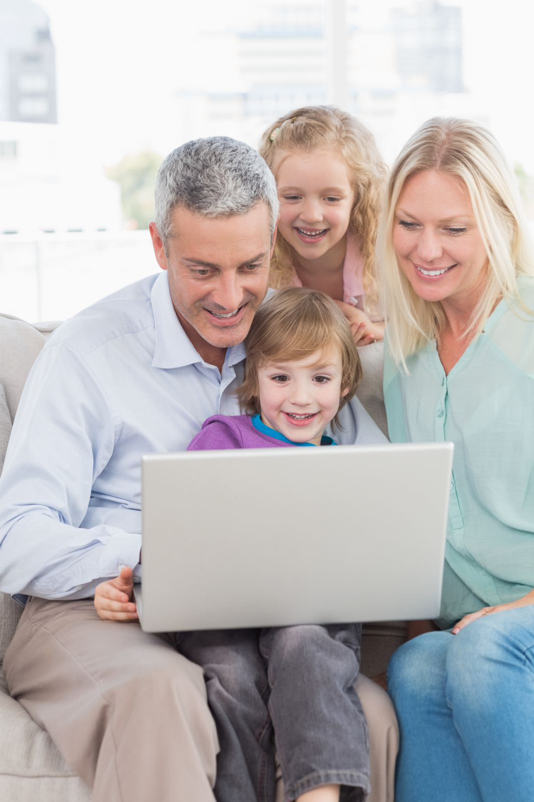 Family looking at laptop together
