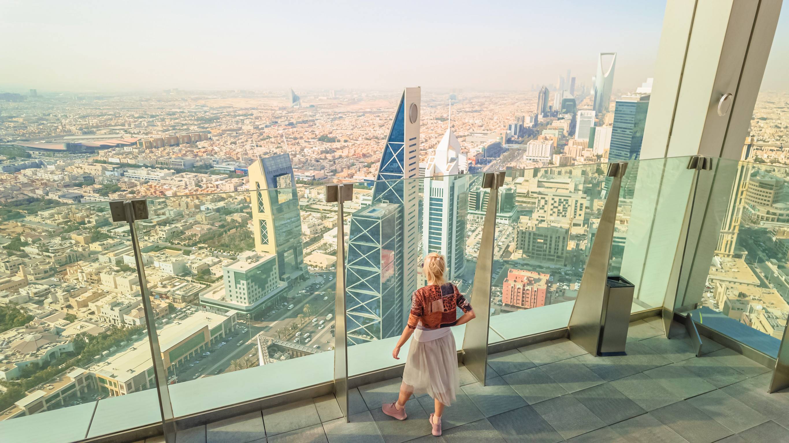 Tourist Enjoying The View Of Riyadhs Skyline